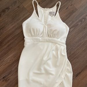 Beautiful homecoming white dress with strappy back and built in bra